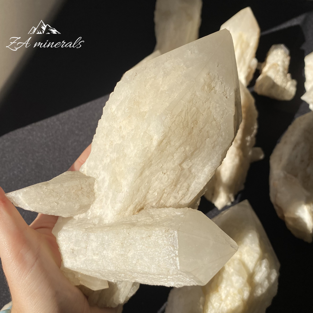 White Quartz crystal in hand for size reference 