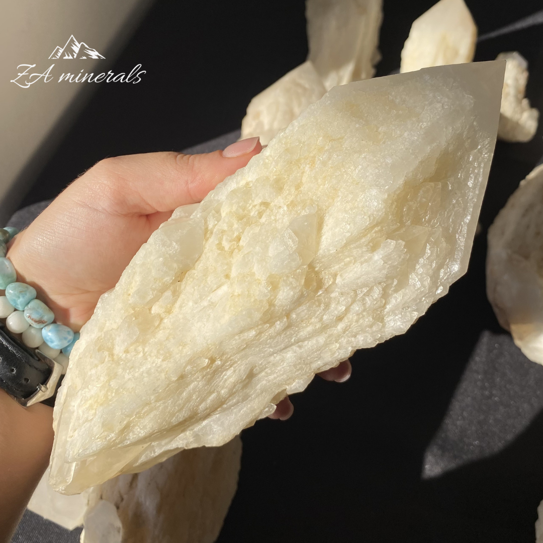 White Quartz crystal in hand for size reference 