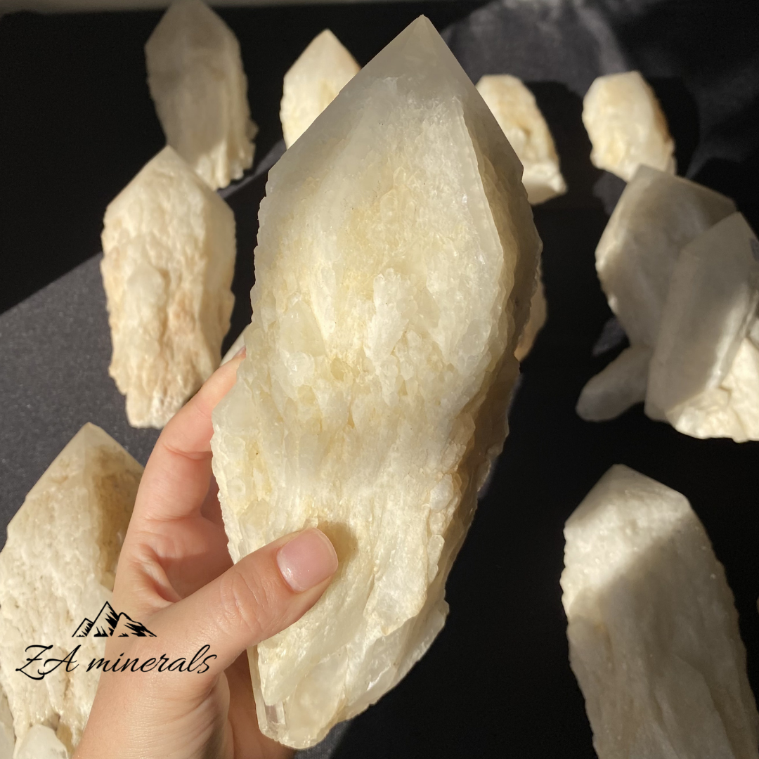 White Quartz crystal in hand for size reference 