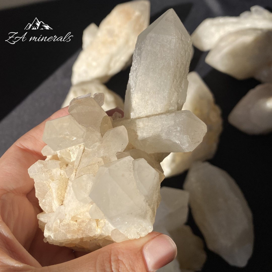 Large White Quartz crystal held in Hand
