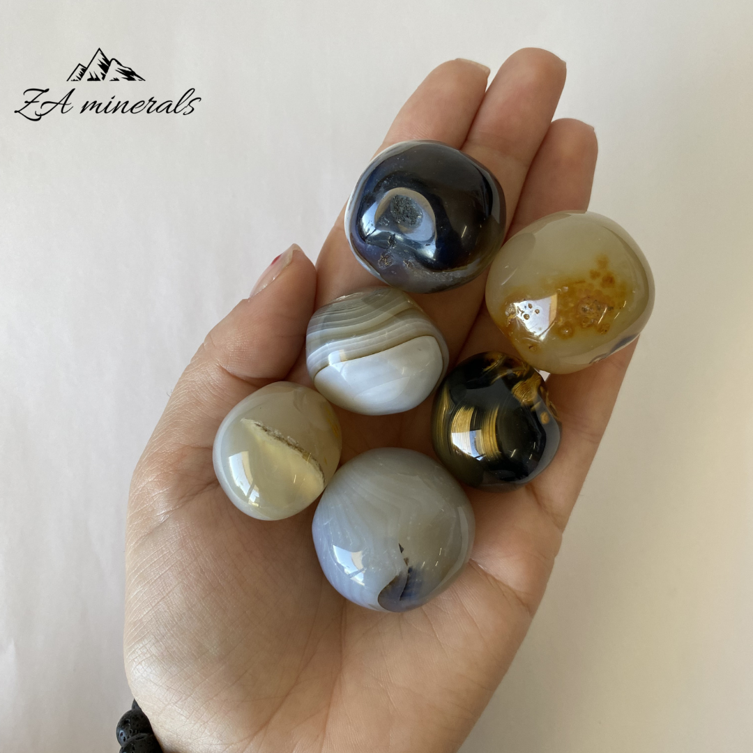 Size reference of  dendritic Agate gumballs in hand