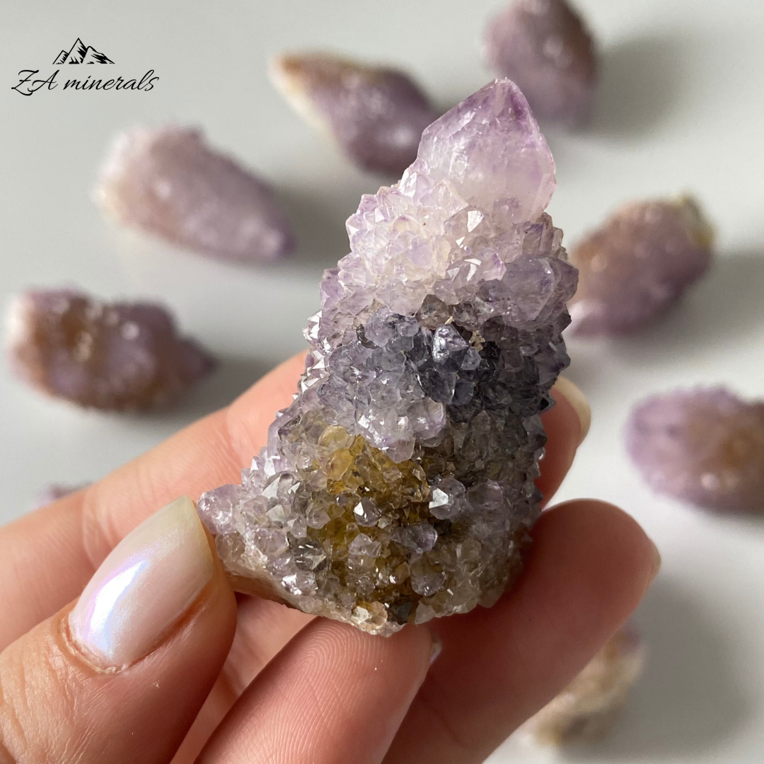 Prismatic Quartz terminations cover the first generation Quartz surface. Vibrant Lavender-purple colour of the Quartz. Lavender-purple zoning can be seen in the crystal terminations. Minor yellow iron staining&nbsp; Scattered chips and damage to the base and perimeter of the crystals.