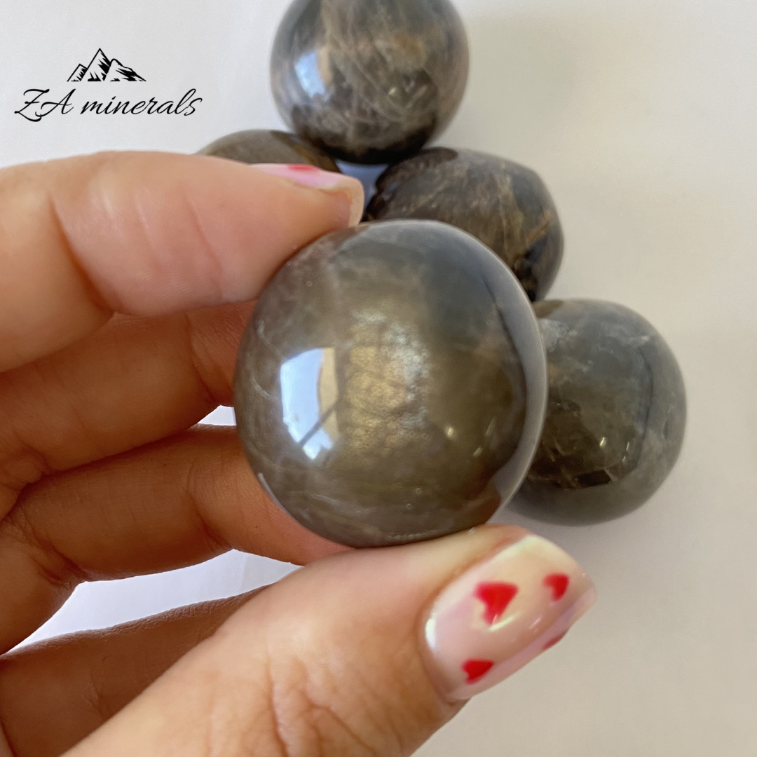 Size reference of Black Moonstone (feldspar) gumball 